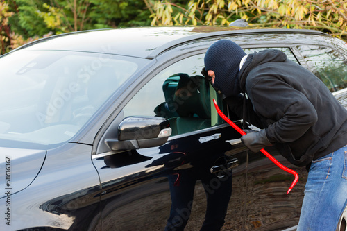 Photo: Car burglar in action Car burglar in action
