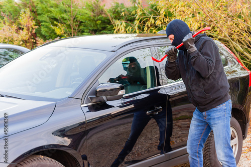 Photo: Car burglar in action Car burglar in action