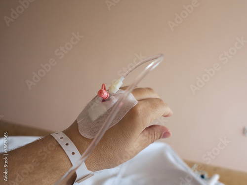 Photo: Patient's hand in the hospital with an IV Patient's hand in the hospital with an IV