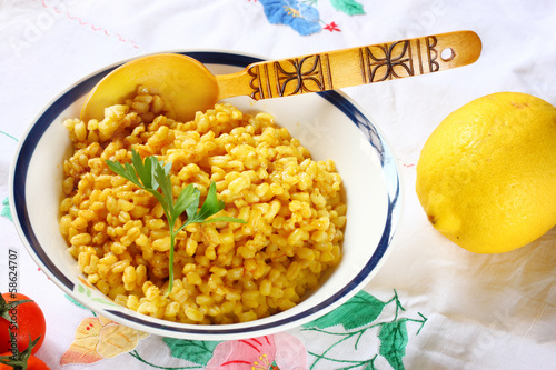 Photo: cooked wheat on wooden table cooked wheat on wooden table