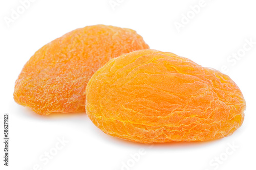 Photo: Two dried apricot fruits isolated on white background Two dried apricot fruits isolated on white background