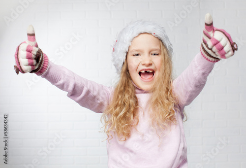 Photo: Child in christmas hat Child in christmas hat