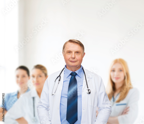 Photo: smiling doctor or professor with stethoscope smiling doctor or professor with stethoscope