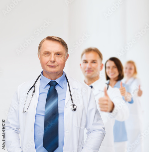 Photo: smiling doctor or professor with stethoscope smiling doctor or professor with stethoscope