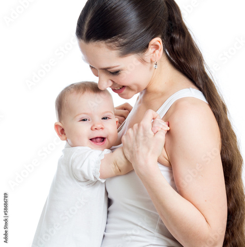Photo: Mother and baby embrace, isolated on white background. Maternity Mother and baby embrace, isolated on white background. Maternity