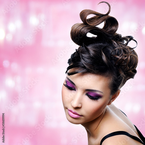 Photo: Face of beautiful woman with fashion hairstyle and glamour makeu Face of beautiful woman with fashion hairstyle and glamour makeu