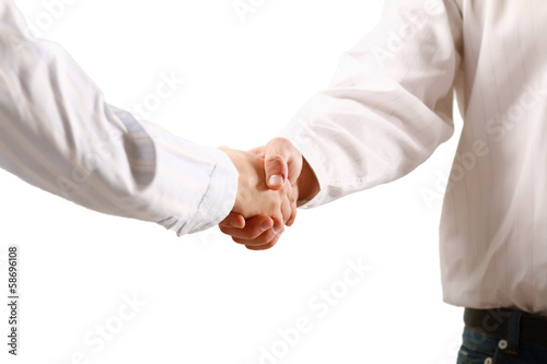 Photo: Closeup of a business handshake, isolated on white. Closeup of a business handshake, isolated on white.