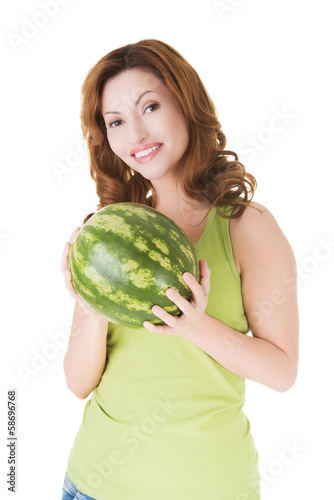 Photo: Attractive casual woman holding watermelon. Attractive casual woman holding watermelon.
