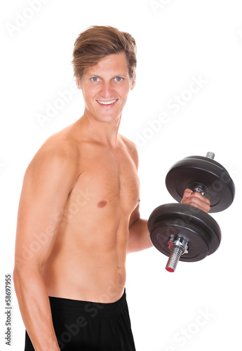 Photo: Man Exercising With Dumbbells Man Exercising With Dumbbells