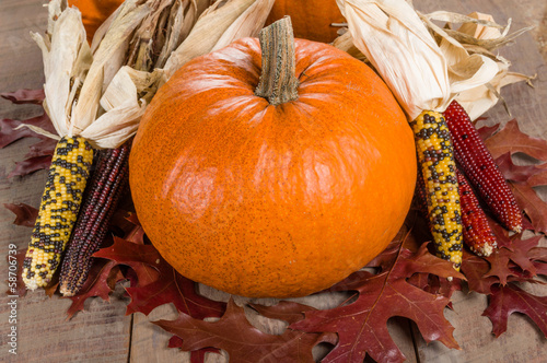 Photo: Pumpkins indian corn and fall leaves Pumpkins indian corn and fall leaves