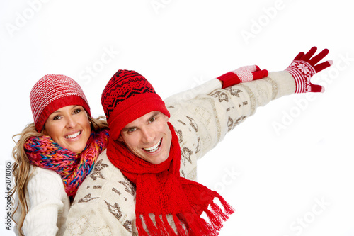 Photo: Happy christmas couple in winter clothing. Happy christmas couple in winter clothing.