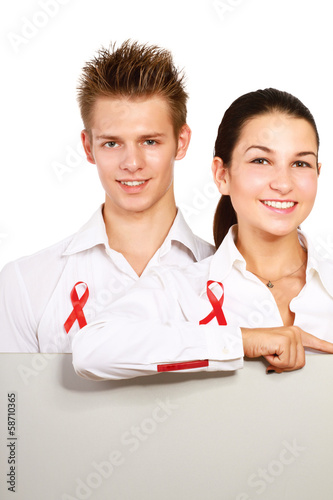Photo: Couple using red for AIDS, holding blank. Couple using red for AIDS, holding blank.