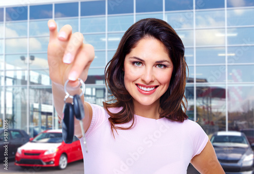 Photo: Beautiful woman with a car key. Beautiful woman with a car key.