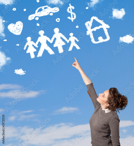 Photo: Young girl daydreaming with family and household clouds Young girl daydreaming with family and household clouds