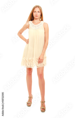 Photo: Cute young blonde woman posing in stylish dress. Cute young blonde woman posing in stylish dress.