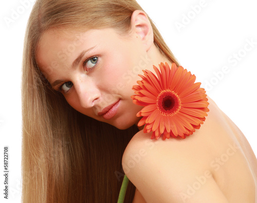 Photo: A beautiful young woman with a flower A beautiful young woman with a flower