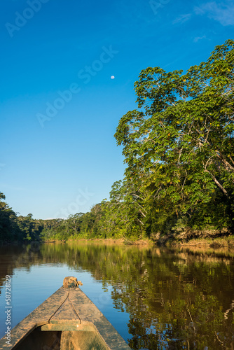 Photo: boat in the river in the peruvian Amazon jungle at Madre de Dios boat in the river in the peruvian Amazon jungle at Madre de Dios