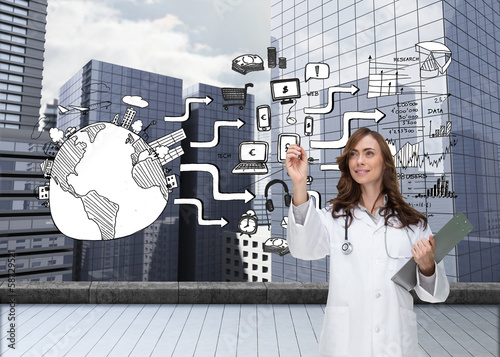 Photo: Composite image of smiling doctor pointing Composite image of smiling doctor pointing
