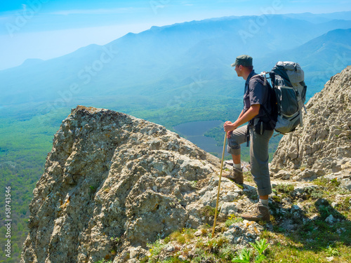 Photo: Hiker enjoys landscape Hiker enjoys landscape