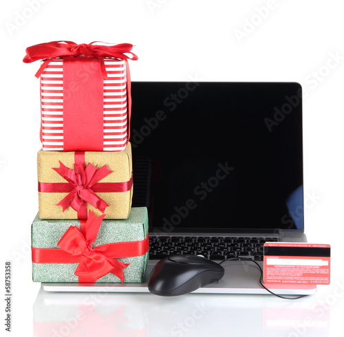 Photo: Laptop, gifts and computer mouse isolated on white Laptop, gifts and computer mouse isolated on white