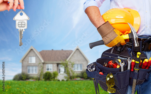 Photo: Worker with a tool belt. Worker with a tool belt.