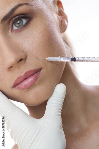 Photo: Cosmetic injection to the pretty woman face Cosmetic injection to the pretty woman face