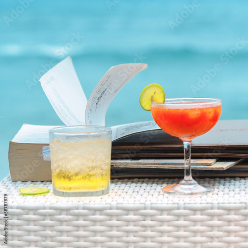 Photo: two coctails on beach . two coctails on beach .