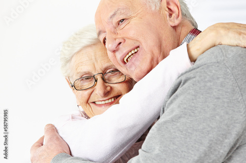 Photo: Happy senior couple embracing each other Happy senior couple embracing each other