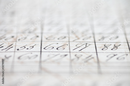 Photo: closeup of vintage handwritten numbers closeup of vintage handwritten numbers