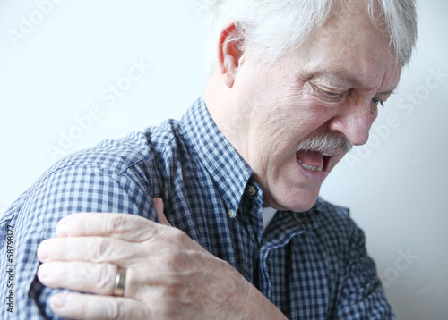 Photo: bad pain in shoulder of senior man bad pain in shoulder of senior man