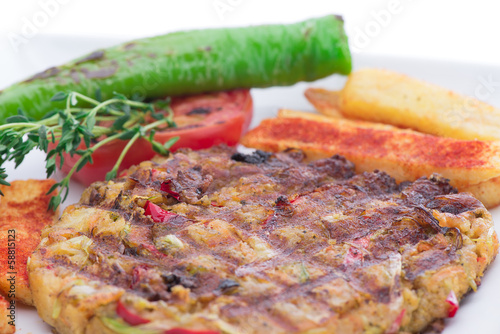 Photo: Vegetarian food on plate with french fries close-up Vegetarian food on plate with french fries close-up