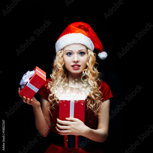 Photo: Santa girl with gift box Santa girl with gift box