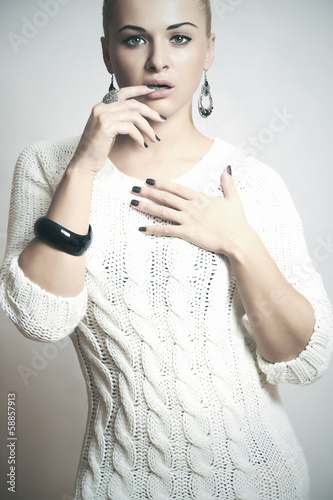 Photo: Beautiful woman in woolen dress.accessories.flirt.fashion Beautiful woman in woolen dress.accessories.flirt.fashion