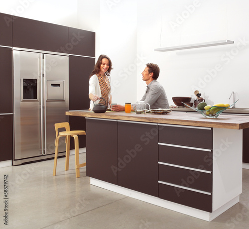 Photo: couple in the modern kitchen couple in the modern kitchen