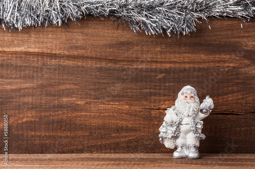 Photo: figure of Santa Claus on old wood framed silver figure of Santa Claus on old wood framed silver
