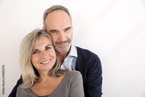 Photo: Cheerful senior couple standing on white background Cheerful senior couple standing on white background