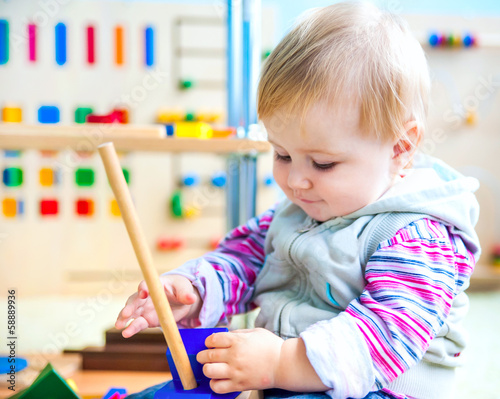 Photo: little girl in the classroom early development little girl in the classroom early development
