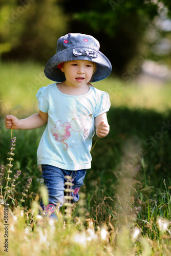 Photo: girl walking in grass girl walking in grass