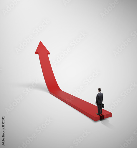 Photo: businessman and red arrow businessman and red arrow