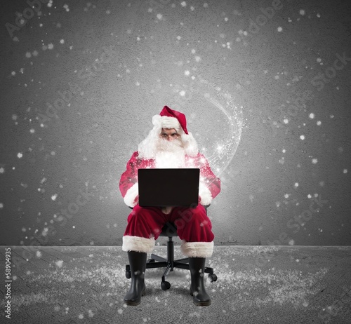 Photo: Santa Claus with laptop Santa Claus with laptop