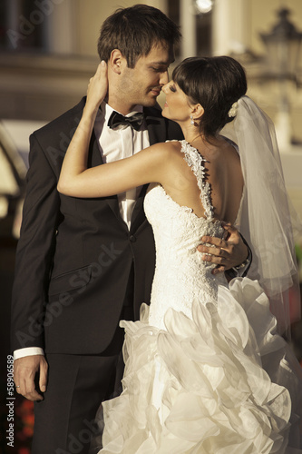 Photo: Lovely marriage couple kissing each other Lovely marriage couple kissing each other