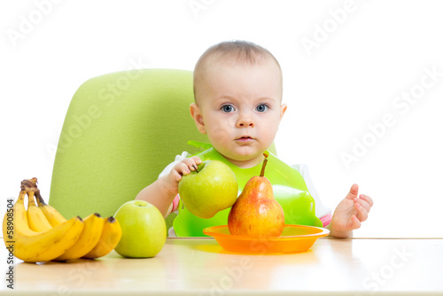 Photo: baby eating healthy solid food fruits baby eating healthy solid food fruits