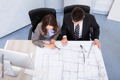 Photo: Two Architect Discussing Two Architect Discussing