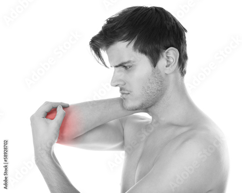 Photo: Man Suffering From Elbow Pain Man Suffering From Elbow Pain
