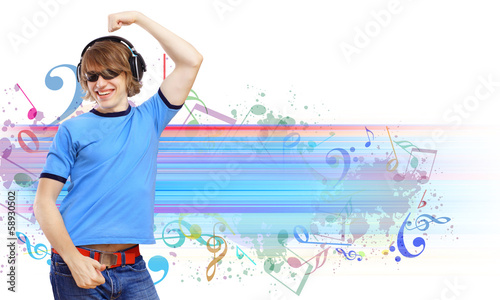 Photo: Happy smiling young man dancing Happy smiling young man dancing
