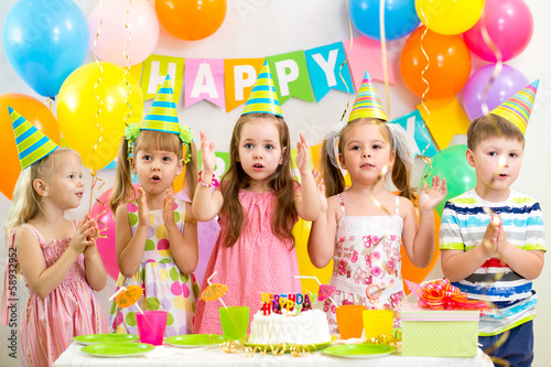 Photo: happy kids celebrating birthday holiday happy kids celebrating birthday holiday
