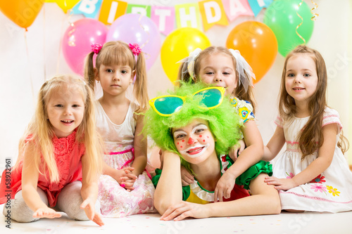 Photo: jolly children and clown on birthday party jolly children and clown on birthday party