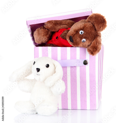 Photo: Textile box with toys, isolated on white Textile box with toys, isolated on white