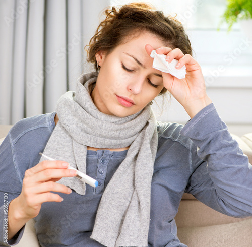 Photo: Sick Woman with Thermometer. Headache Sick Woman with Thermometer. Headache