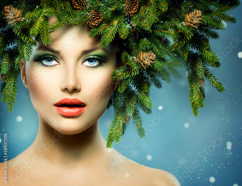 Photo: Christmas Woman. Christmas Tree Holiday Hairstyle and Makeup Christmas Woman. Christmas Tree Holiday Hairstyle and Makeup